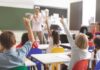 Blue Governors Cornered – Unions Try To Kill ‘Free Money’ Elementary students raise hands in a classroom