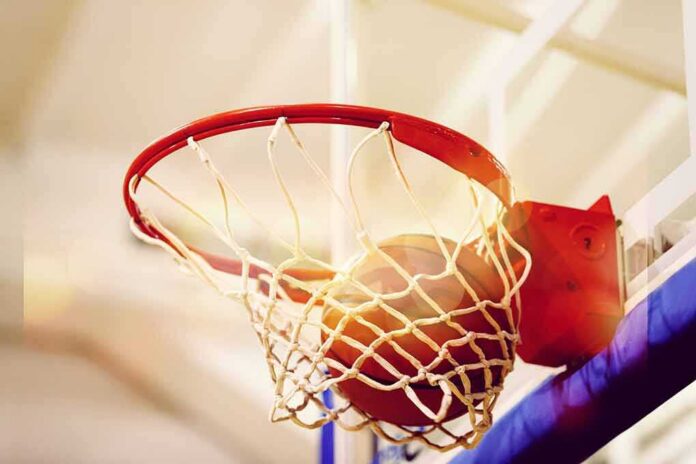 shutterstock_1518283271 Basketball going through a hoop