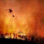 Firefighting Chaos: Mid-Air Smash Helicopter fights massive wildfire over burning forest