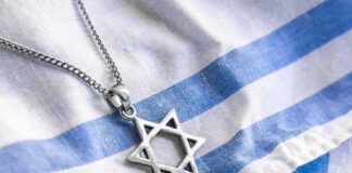 Star of David pendant on blue and white cloth