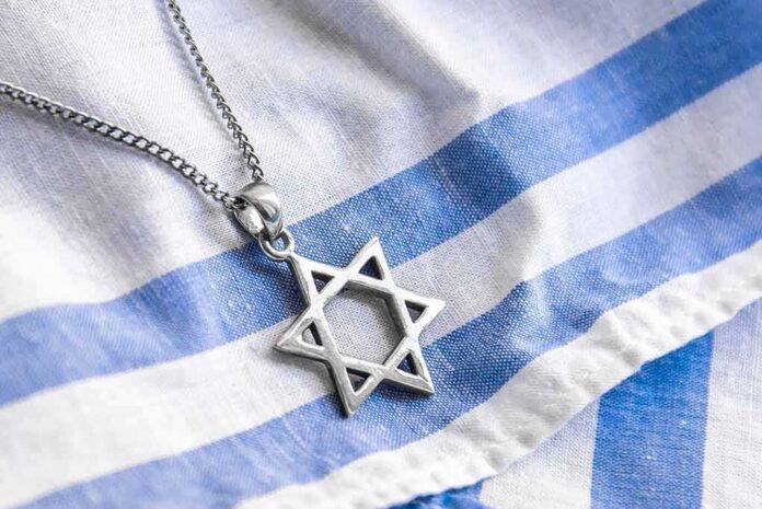 Star of David pendant on blue and white cloth