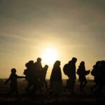 Muslim Entries PLUMMET – Refugees Stop Cold silhouettes of people walking at sunset