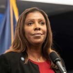 Woman speaking at a press conference microphone