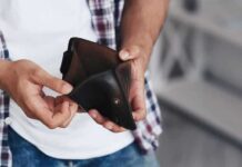 Inflation Pops—Rate Hike Fears Ignite person holding an open empty wallet