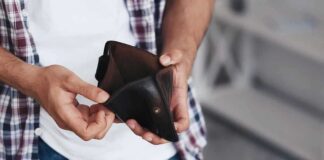person holding an open empty wallet