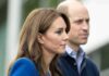 Prince William, Duke of Cambridge, standing slightly behind a woman in profile outdoors
