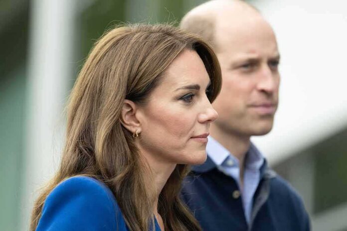 shutterstock_2374497723 Prince William, Duke of Cambridge, standing slightly behind a woman in profile outdoors