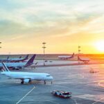 Covert Airlift Exposed — Operation Outcast Grounds Iran’s Lifelines Airplanes on airport tarmac at sunset