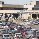 Flesh-Eating Threat—Border Reopens Anyway Border inspection station with heavy vehicle traffic