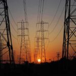 Power transmission towers at sunset