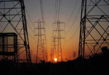 Refineries Burn, Grids Targeted – Winter Gets Dangerous Power transmission towers at sunset