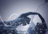 Paxton’s AI Gambit Sparks Outrage Hand touching a tablet screen with abstract network overlay