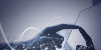 Hand touching a tablet screen with abstract network overlay