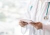 Hospital Trip Exposes Chilling Mansion Ring Doctor with stethoscope using a tablet