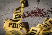 Vienna Chaos: Midnight Gunfire Shocks Georgia Town Crime scene tape near blood on pavement