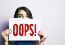Media Blunder: Rush-To-Russia Report Implodes On Air Woman holding a sign that says OOPS in red