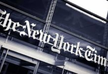 Rhetoric On Trial – Impeach The President? The New York Times sign on a glass building facade