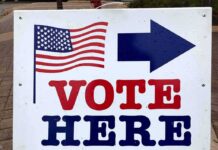 Noncitizen Vote Ban Gutted – For Now voting sign with arrow and American flag