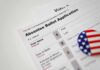 30% Slide – Wisconsin Mail Votes PLUNGE Absentee ballot application with patriotic button