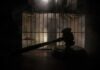 Witnesses Hear Breathing – Governor Slams Brakes After Chaotic Execution Judge’s gavel in silhouette before prison bars