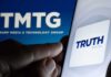 Truth Social Spiral: Bleeding Users, Vanishing Revenue? Smartphone showing Truth Social app icon beside TMTG logo on screen