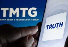 Truth Social Spiral: Bleeding Users, Vanishing Revenue? Smartphone showing Truth Social app icon beside TMTG logo on screen