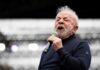 Luiz Inácio 'Lula' da Silva speaking into a microphone on stage