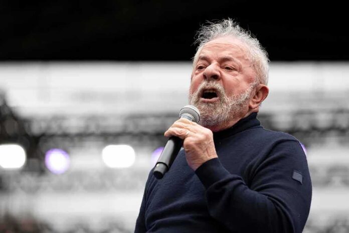Luiz Inácio 'Lula' da Silva speaking into a microphone on stage