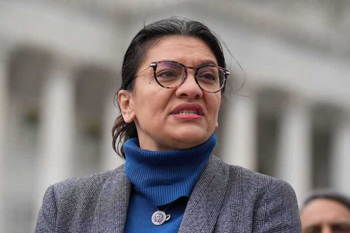 woman in glasses speaking outdoors