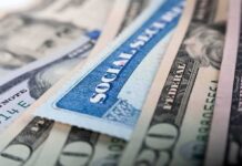 Social Security card on US dollar bills