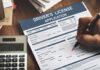 Driver's license application form being filled out by hand