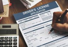 Driver's license application form being filled out by hand
