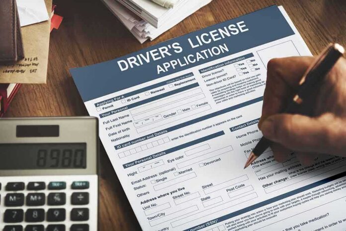 shutterstock_505805506 Driver's license application form being filled out by hand